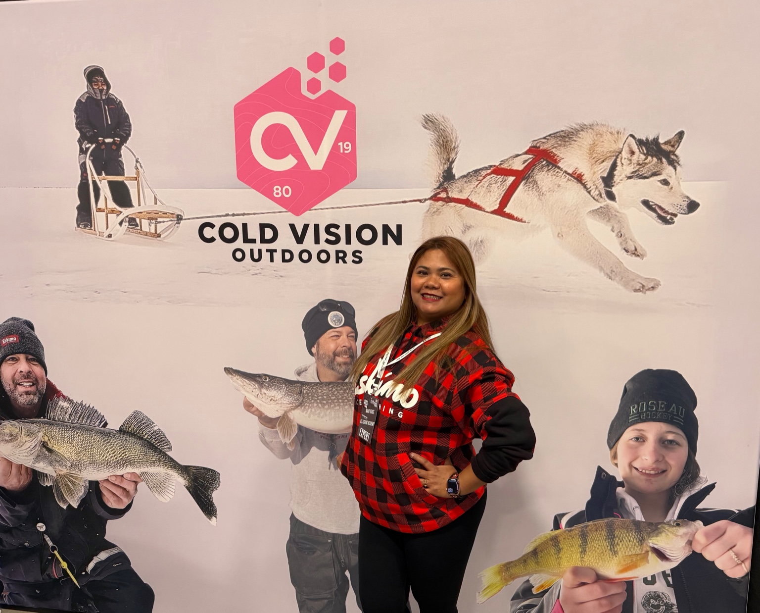 Rhica Chan smiling in front of a Cold Vision Outdoors backdrop